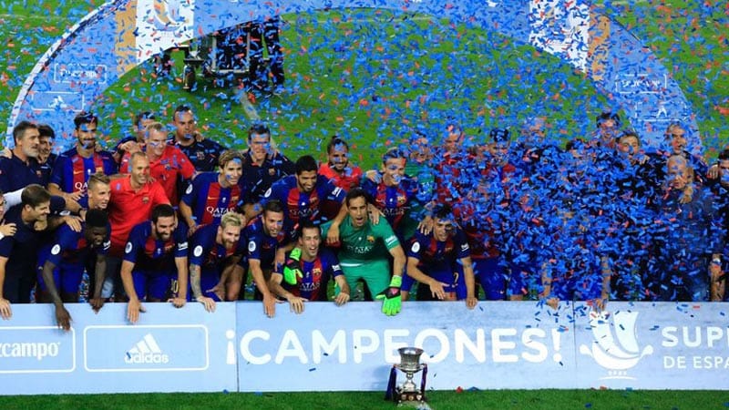Turan and Messi combine to give Barca a domestic treble