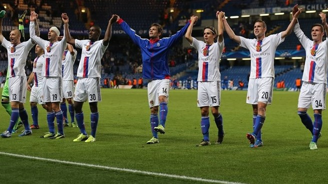 FC Basel 1893 players celebrate in front of their fans after their UEFA Champions League group stage match against Chelsea FC
