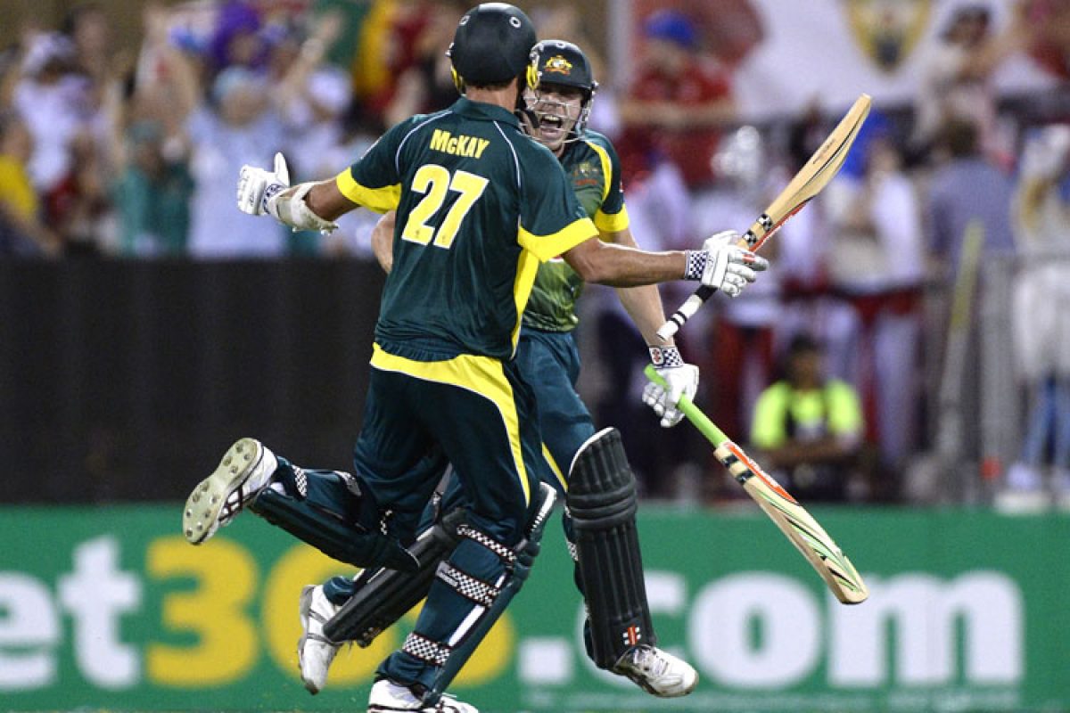 James Faulkner and Clint McKay of Australia Cricket celebrate victory